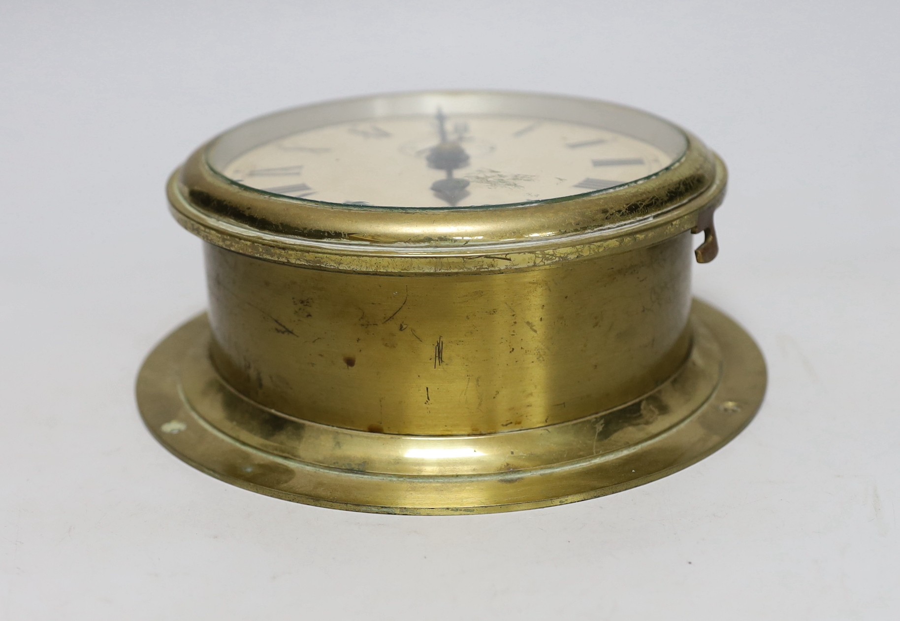 A ship's clock, made by Elliot Ltd Croydon, back plate 20.5cm diameter